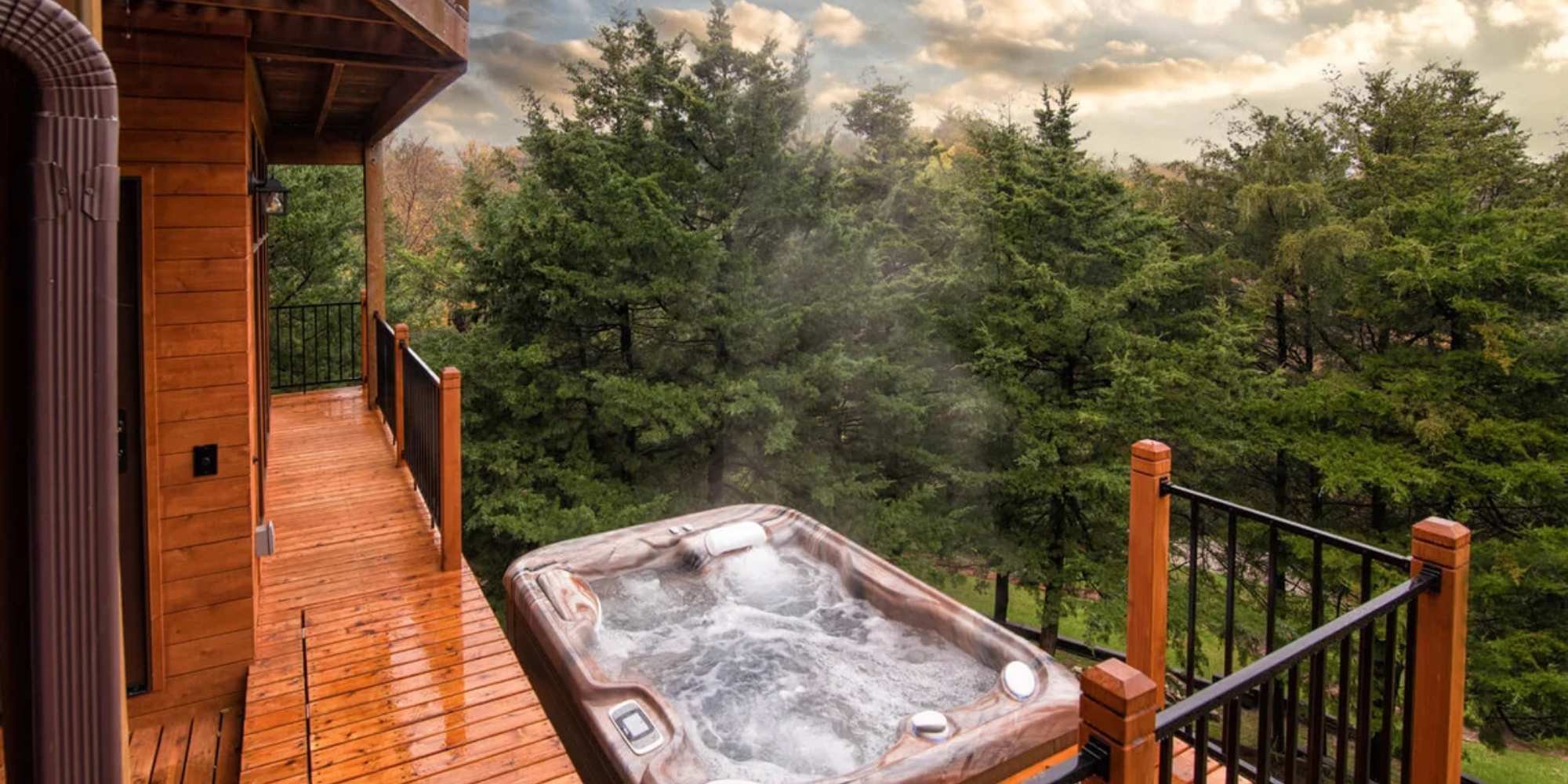 Image of a multi-story wood deck with railing and hottub by Fox Home Innovations in Manhattan, KS