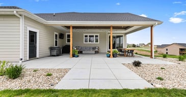 Covered patio remodel with natural wood pillars and upgraded windows by Fox Home Innovations in Manhattan, KS