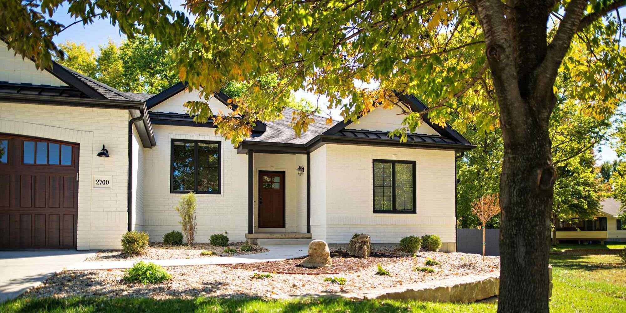 Newly remodeled home exterior with new windows and siding in Manhattan, KS by Fox Home Innovations