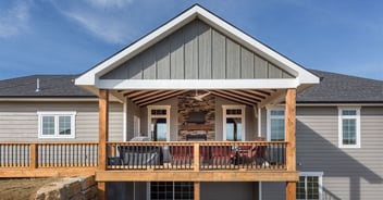 Front view of a remodeled home with a porch and new siding in Manhattan, KS by Fox Home Innovations
