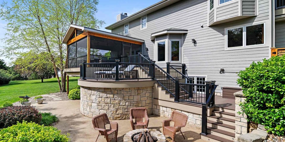 A remodeled home with a screen porch, patio, and new siding in Manhattan, KS by Fox Home Innovations-1