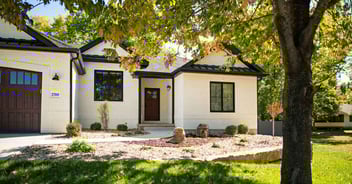 Exterior of a whole home remodel with white brick in Manhattan, KS by Fox Home Innovations