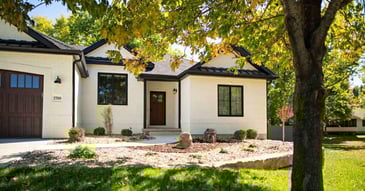 Exterior of a whole home remodel with white brick in Manhattan, KS by Fox Home Innovations