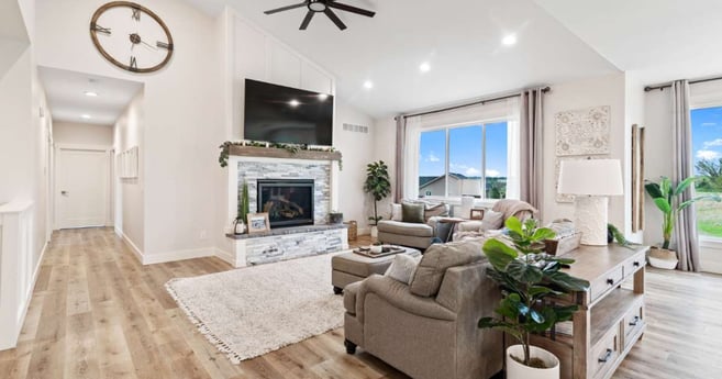 Remodeled living room with stone feature fireplace in Manhattan, by Fox Home Innovations