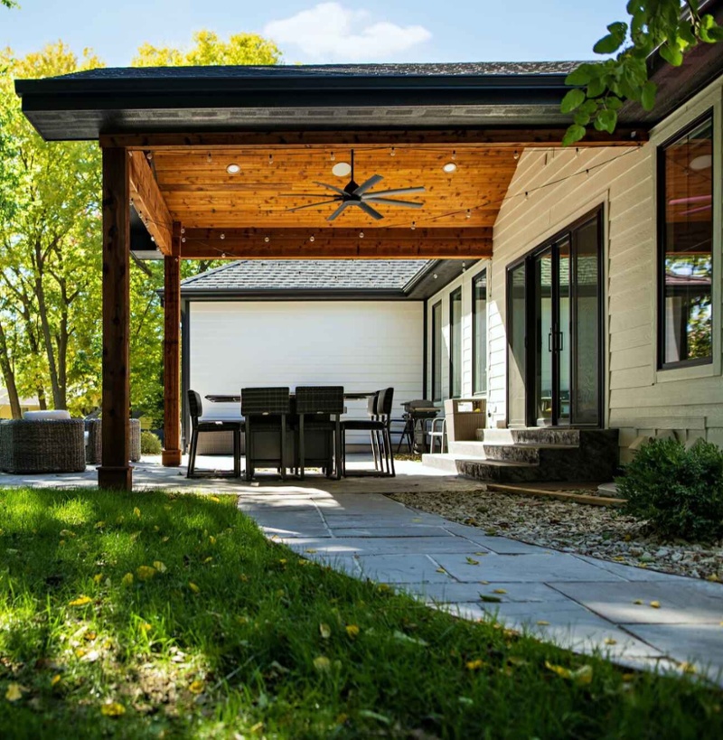 Outdoor patio with wood overhang.