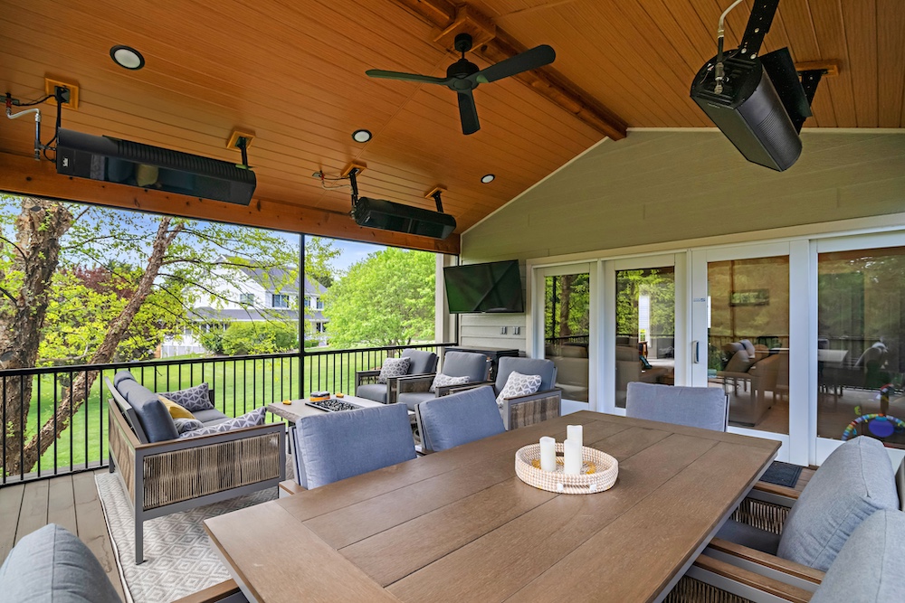 Covered deck with wood paneled ceiling